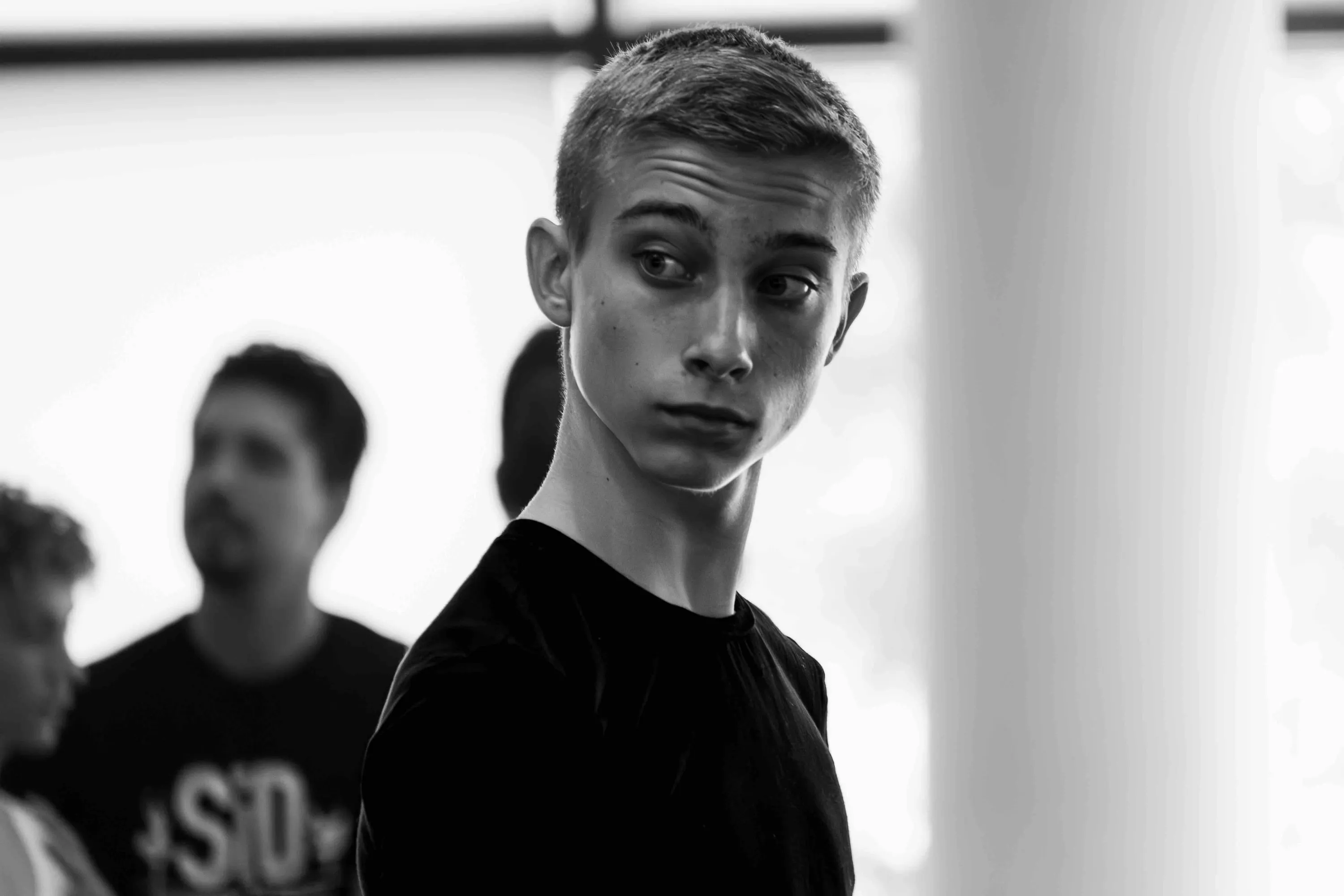 A young student turns to look into the camera