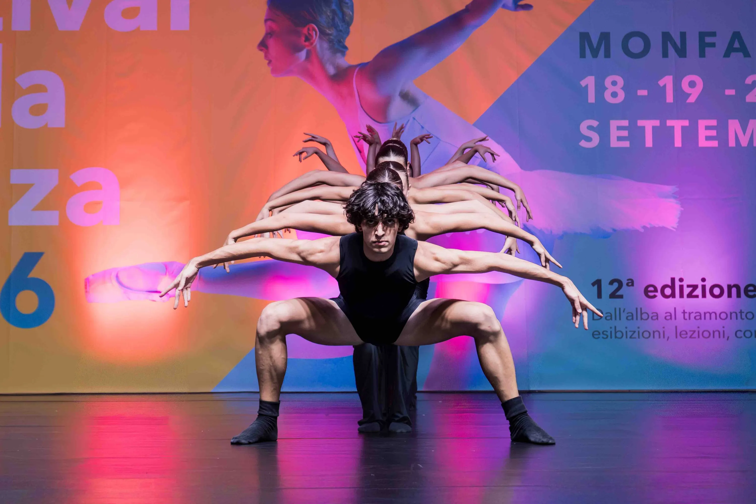 A dancer in front with many arms fanned out behind him