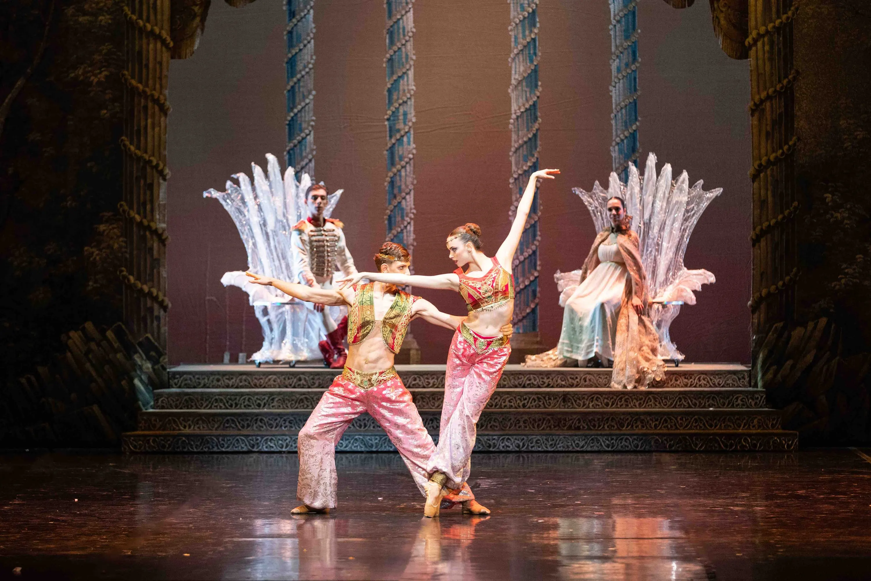 A pas de deux in oriental costumes before two thrones