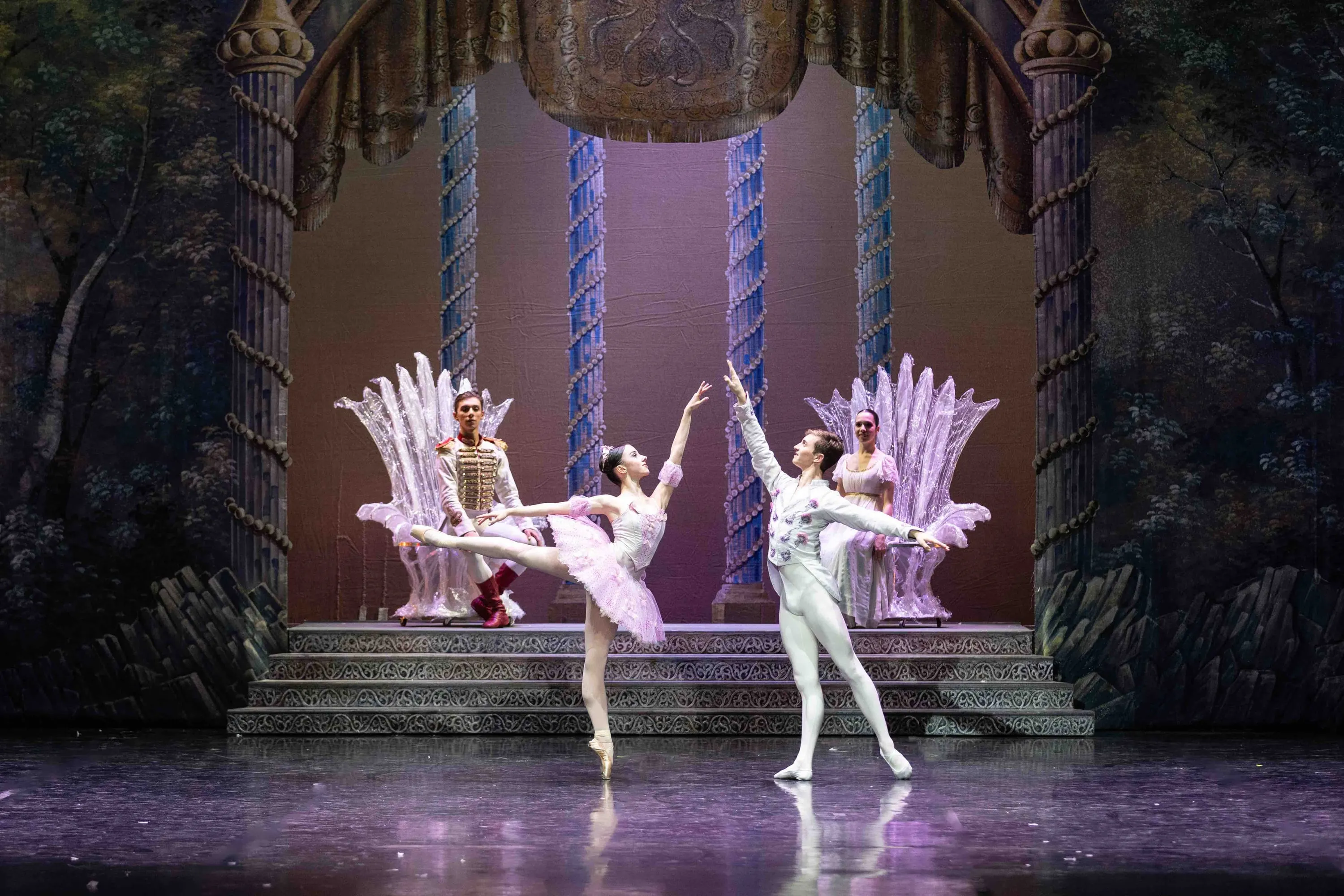 The ballerina in pink and the prince in white at centre stage